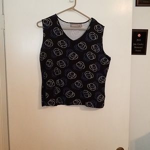 Short top with blue and white circles.
